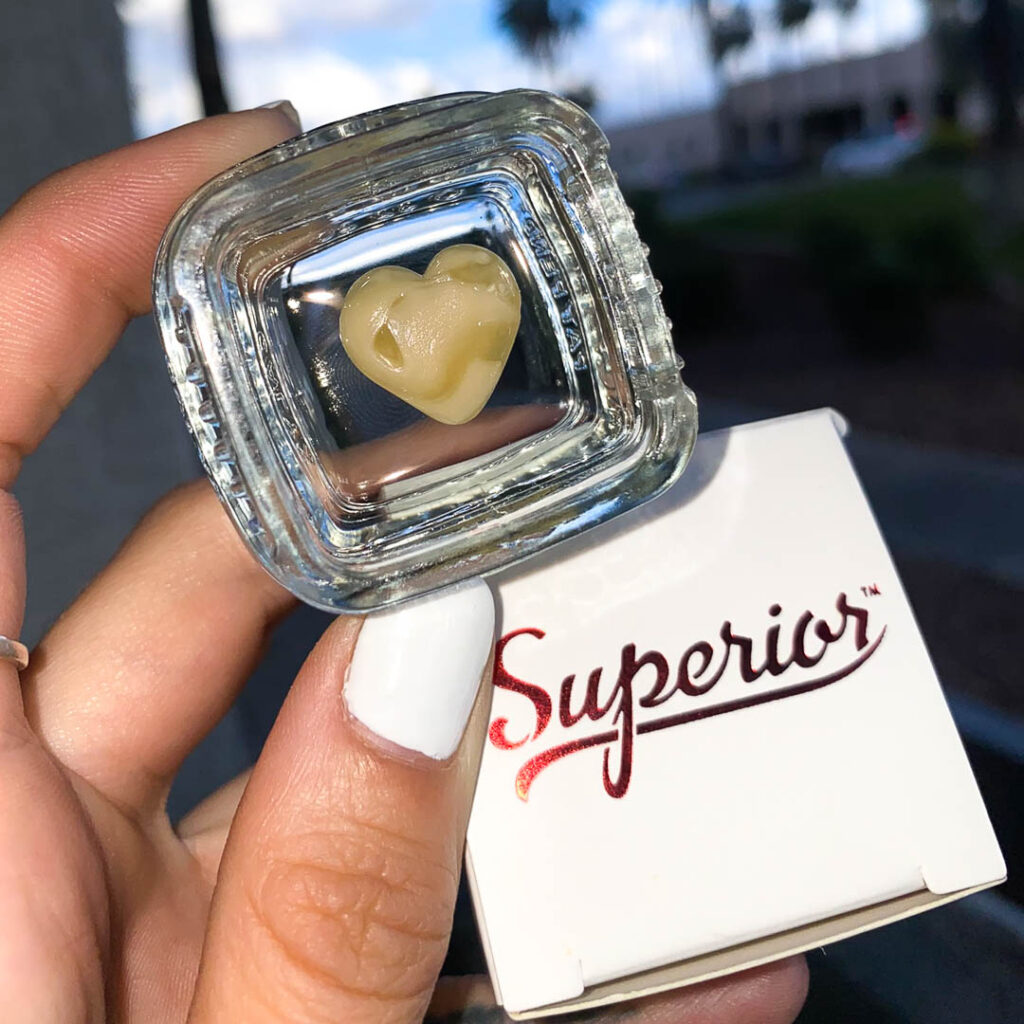 a close up of a heart shaped yellow substance with a superior box