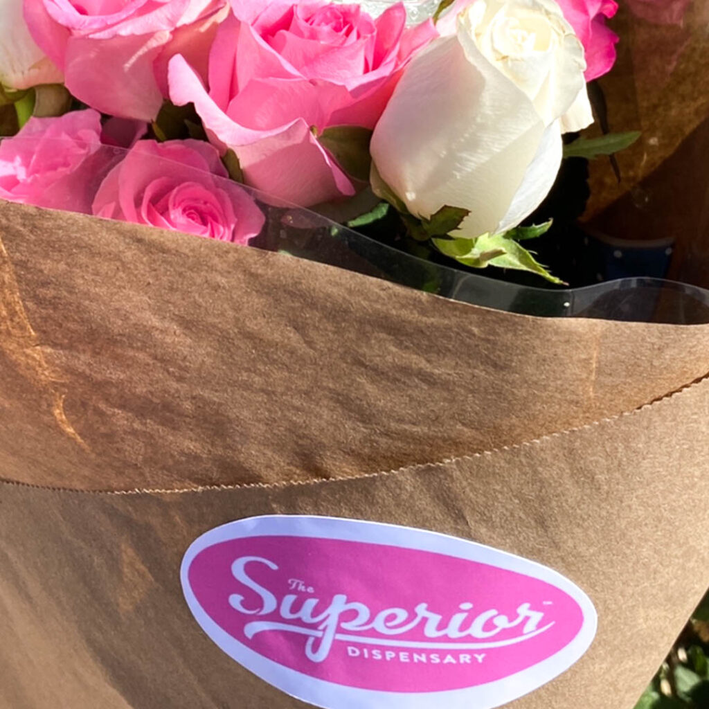 A close up image of a bouquet of flowers with the superior dispensary sticker