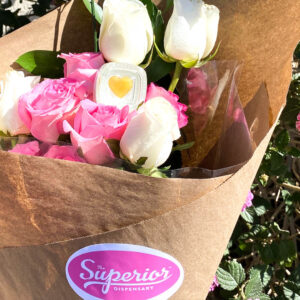 a bouquet of flowers with a yellow heart cannabis item on it.